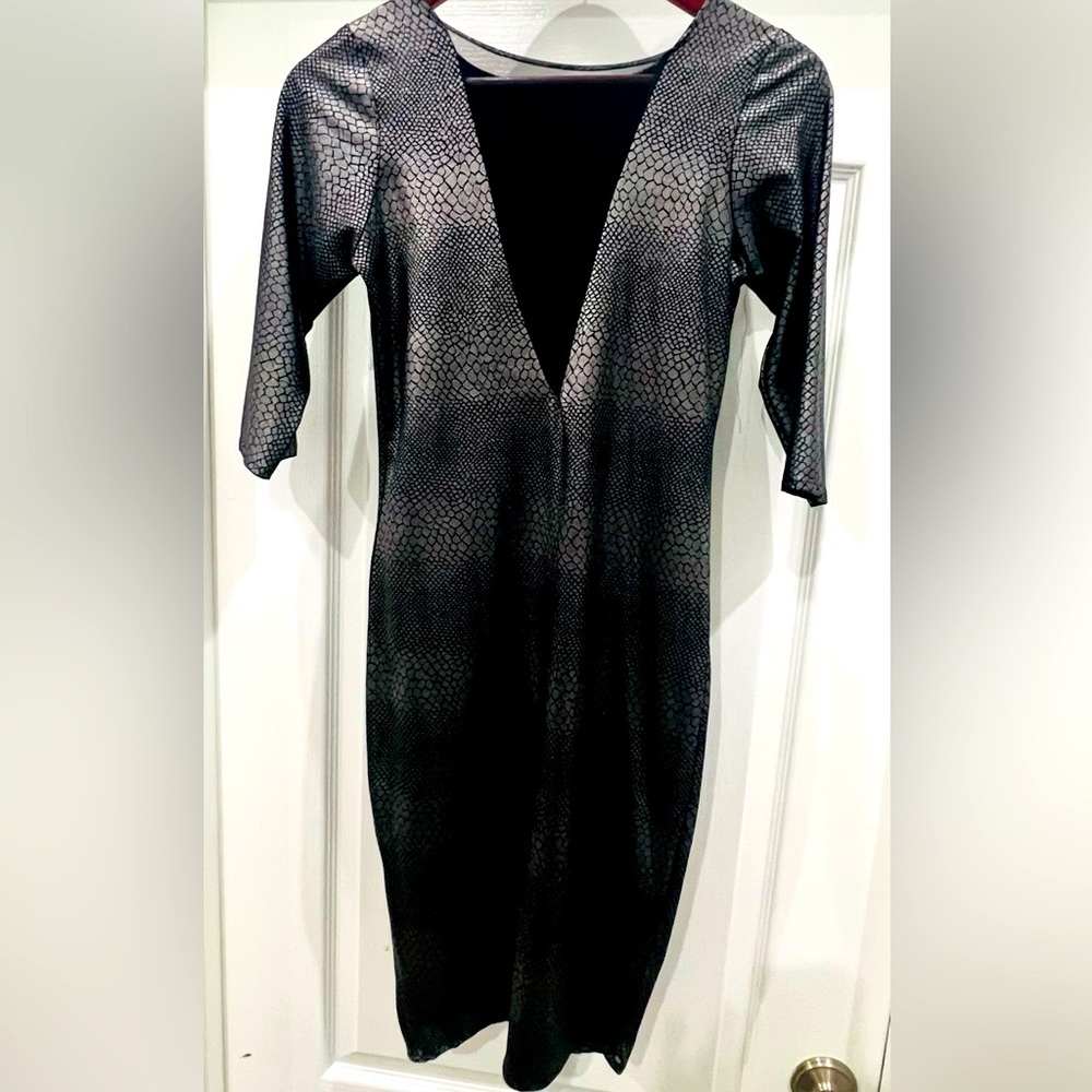 Sexy black and metallic dress. Super stretchy and form fitting.